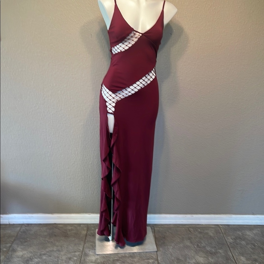 Elegant Asymmetrical Burgundy Dress with Chic Open Areas - Picture 1 of 9